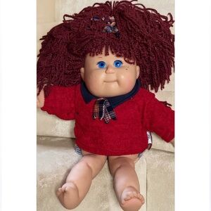 Adorable Red-Haired Doll with Blue Eyes